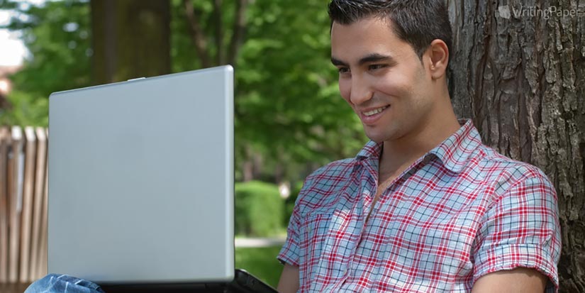 Boy Typing on Laptop